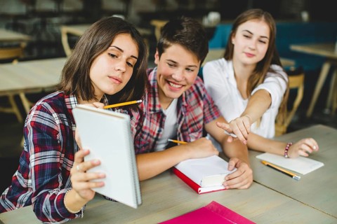 Cheerful students playing classroom