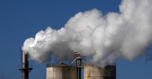 Smokestack of Sugar Refinery with Water Vapour, Near Caen in Normandy