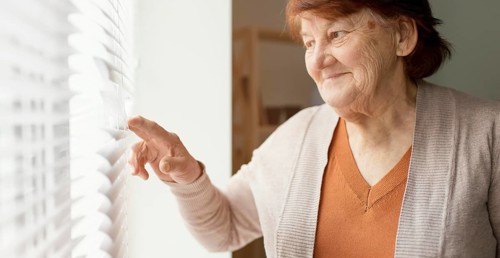 Close up woman looking out window
