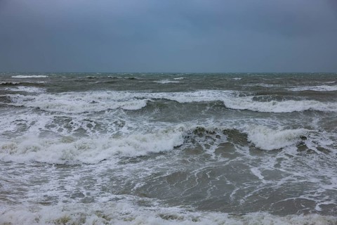 Stormy sea, foaming sea in storm with high waves on the English Channel, Portbail, Cotentin,
