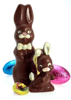 Easter Eggs and Chocolate Easter Rabbit against White Background