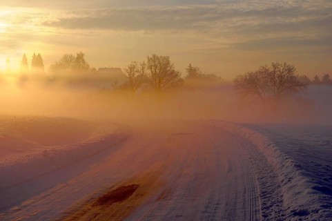 Sunrise with snow at Maulbronn, morning mood, fog with snow, dirt road with snow, sun with rays,