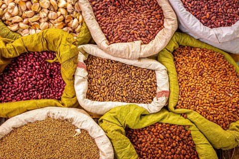 Variety of beans and spices at an organic local market