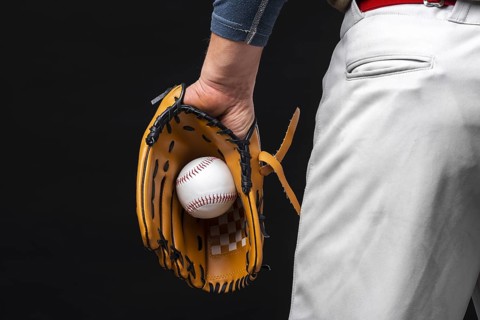 Back view man holding glove with baseball. Resolution and high quality beautiful photo