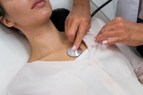 Doctor checking heart rate patient