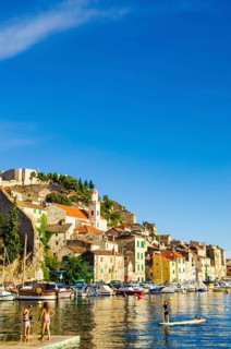 Croatia, 21 07 2014: Old town streets in town Sibenik with marble and stone buildings in background