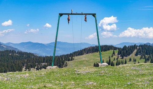 A picture of the landscape of Velika Planina, or Big Pasture Plateau, as seen through a ski lift