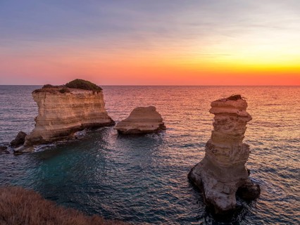 Meledugno town in Italy, Puglia Region. Spectacular view at sunrise on Santo Andrea cliffs