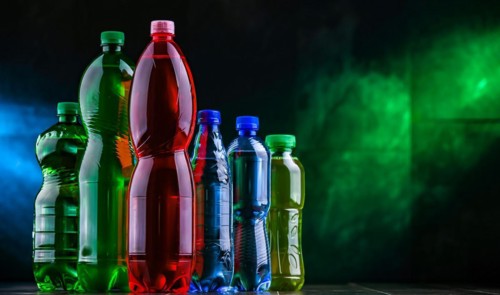 Plastic bottles of assorted carbonated soft drinks