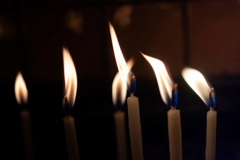 Candle lights in the darkness. Abstract candles background. Hope, fire