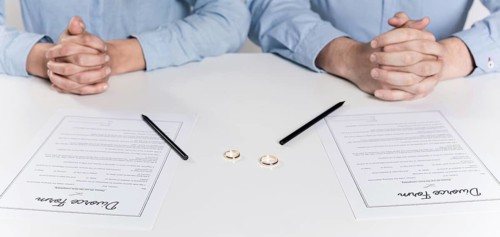 Couple getting ready sign divorce forms