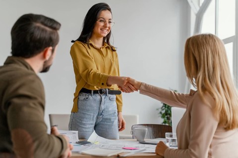 Businesswomen shaking hands work