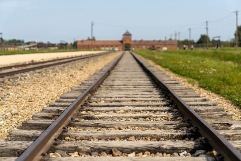 Auschwitz, Poland - 15 September, 2021: selective focus low angle view of the railroad tracks
