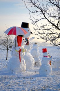 Snowman Family with animal figures, winter landscape Snowman Family with animal figures, winter