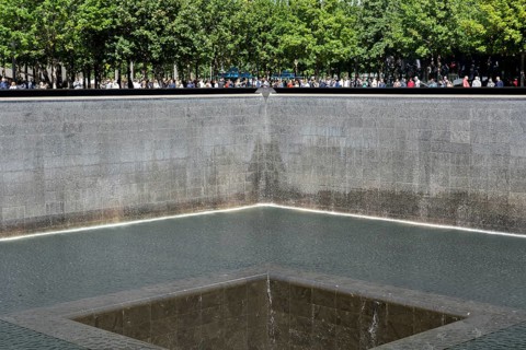 New York, United States of America, September 19, 2019: People standing at the north pool of the