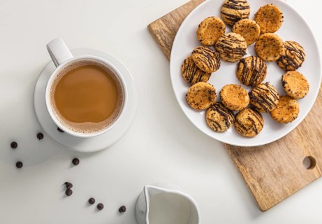 Top view coffee cup with plate cookies