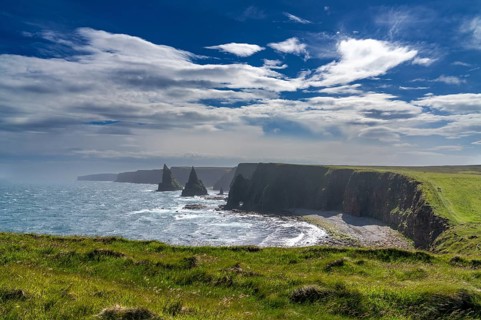 A view of the Duncansby Sea Stacks and wild and rugged coastline of Caithness in the Scottish