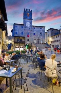 Cortona Arezzo Tuscany Italy. Palazzo del Popolo in Piazza della Repubblica at sunset