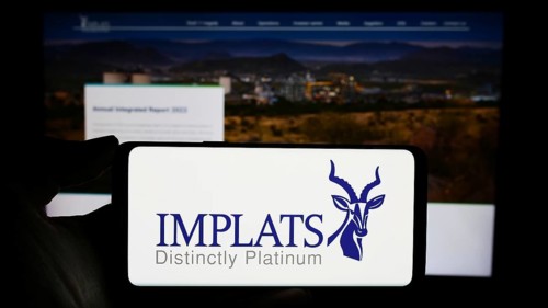 Stuttgart, Germany, 12-07-2023: Person holding cellphone with logo of company Impala Platinum