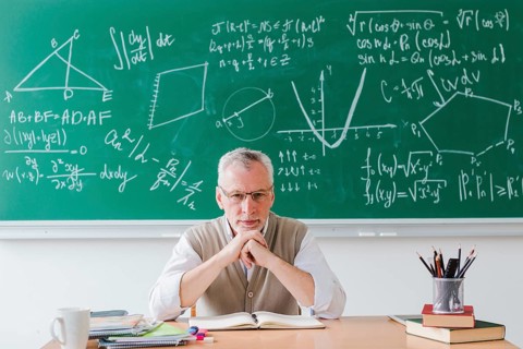 Strict teacher looking camera classroom