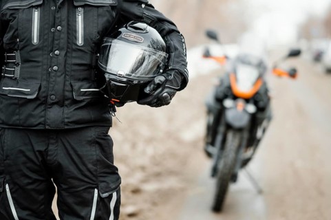 Men riding motorcycle winter day