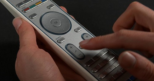Hands of Woman with remote control