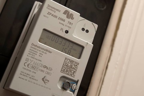 Symbolic image of energy costs in the household, digital electricity meter in a flat, operator