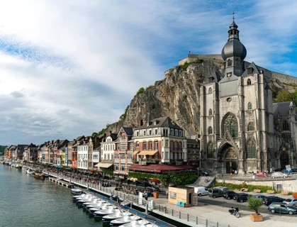 Belgium - 11 August 2019: horizontal view of the Meuse River and the historic old riverside town of