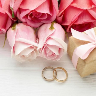 Close up pink roses wedding rings. High resolution photo