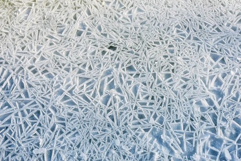 Frozen ice texture on the Dnieper river in Kiev, Ukraine, during winter, Europe
