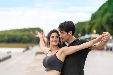 Couple in love holding their arms outstretched