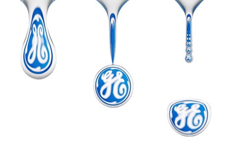 Closeup, macro sequence, water drop, dripping off of a sponge, logo of General Electrics reflected