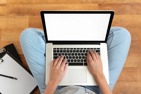 Top view woman working home during quarantine with laptop