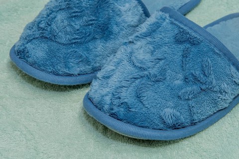 Closeup of dark blue slippers on light colored fabric background, South Korea, South Korea, Asia