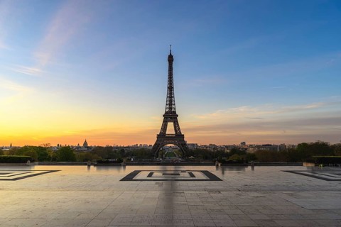 Paris France city skyline sunrise at Eiffel Tower and Trocadero Gardens