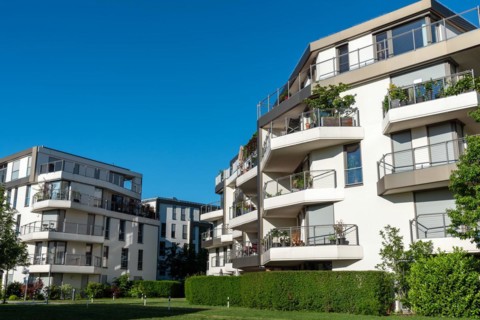 New apartment buildings seen against a blue sky in Munich, Germany, Europe