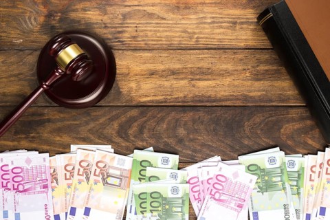 Top view arrangement with judge gavel book money
