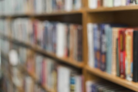 Blurred books library shelves