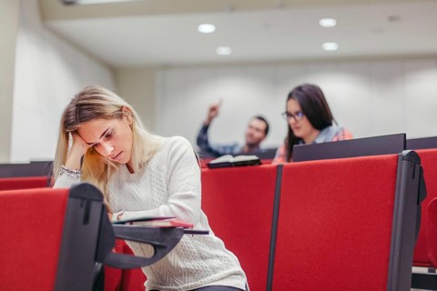 Group students sitting boring seminar