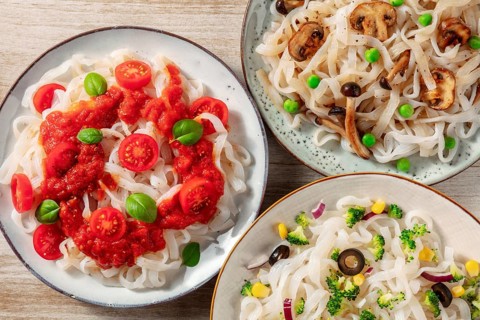 Konjac pasta with tomato sauce, mushrooms, and broccoli, shot from the top