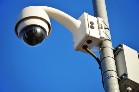 Hi-tech dome type camera over a blue sky