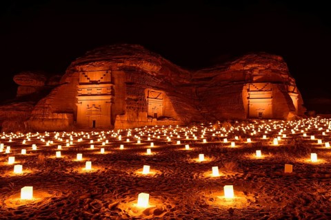 Illuminated Nabataean tombs at night, Hegra or Mada'in Salih, AlUla region, Medina province, Saudi