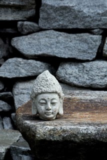 Buddha head on stone slab