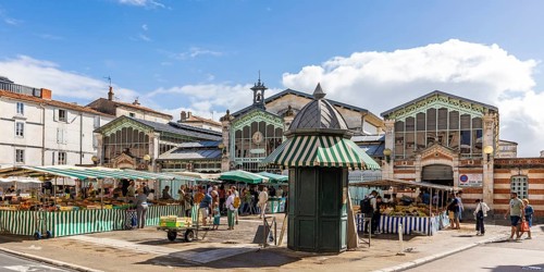 Market stalls in front of the historic market hall in the old town, La Rochelle, Atlantic coast,