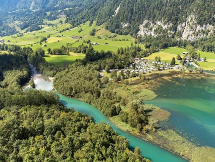 The Vorauen campsite on Lake Klöntal with the Chlü tributary, Klöntal, Canton Glarus, Switzerland,