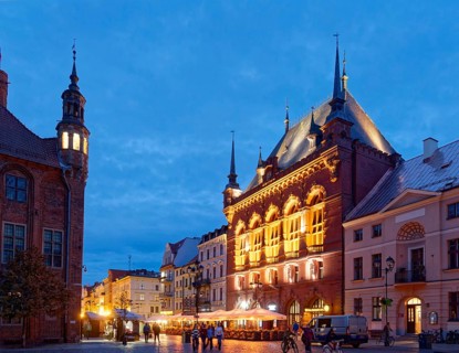 The Areszt sledczy in the medieval old town of Thorn, illuminated in the evening. The historic city