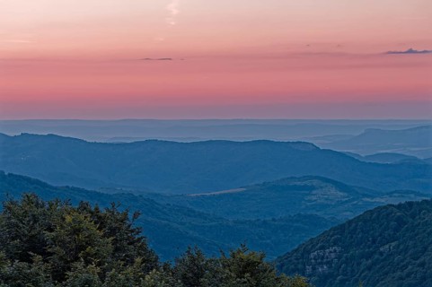 Dawn over the mountain landscape of the Balkan Mountains and the wooded slopes of the Balgarka