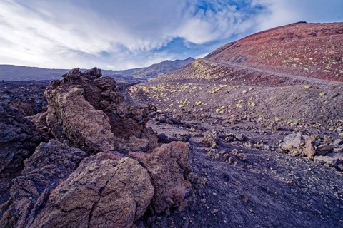 Lava rock and crater landscape around the Crateri Silvestri in the Etna National Park, Parco