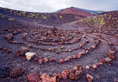 Stones laid in a circle in the crater landscape around the Crateri Silvestri in the Etna National