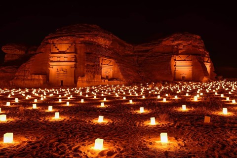 Illuminated Nabataean tombs at night, Hegra or Mada'in Salih, AlUla region, Medina province, Saudi